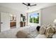 Light-filled bedroom boasts an en-suite bathroom, neutral decor, and plush carpeting at 3011 Yada Ln, Charlotte, NC 28208