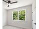 Spacious bedroom offers a large window with lush green views and neutral finishes at 3011 Yada Ln, Charlotte, NC 28208