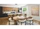 Spacious dining area with modern lighting and sleek white countertops in a modernly designed home at 3011 Yada Ln, Charlotte, NC 28208