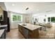 Modern kitchen featuring stainless appliances, an island with seating, and open concept living at 3011 Yada Ln, Charlotte, NC 28208