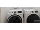 Modern, white front loading washer and dryer set in laundry room at 3011 Yada Ln, Charlotte, NC 28208