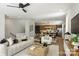 Bright living room featuring modern decor, comfortable seating, and an open-concept design with a kitchen and dining area at 3011 Yada Ln, Charlotte, NC 28208