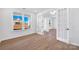 Bright living room with hardwood floors, French doors, and large windows for ample natural light at 3057 Tramore Dr, Harrisburg, NC 28075