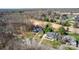 Beautiful aerial view showing two homes among mature trees and landscaping at 315 Muirfield Way, Salisbury, NC 28144