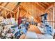 Unfinished attic space with exposed wooden beams, offering potential for storage or customization at 315 Muirfield Way, Salisbury, NC 28144