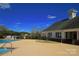 Community pool area featuring a sun deck and views of the community clubhouse at 315 Muirfield Way, Salisbury, NC 28144
