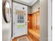 A well-lit foyer features a wooden bench with hooks, a decorative mirror, and a windowed front door at 315 Muirfield Way, Salisbury, NC 28144