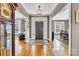 Inviting foyer with hardwood floors, a decorative rug, and an elegant light fixture at 315 Muirfield Way, Salisbury, NC 28144
