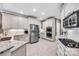 Bright kitchen featuring white cabinetry, stainless steel appliances, and granite countertops at 315 Muirfield Way, Salisbury, NC 28144