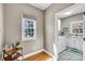 Bright laundry room with white appliances, a window for natural light, and modern finishes at 315 Muirfield Way, Salisbury, NC 28144