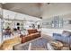 Spacious living room with a cozy fireplace, open to the kitchen and dining area with vaulted ceilings at 315 Muirfield Way, Salisbury, NC 28144