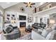 Cozy living room featuring a fireplace with built-in shelving and comfortable leather sofas at 315 Muirfield Way, Salisbury, NC 28144