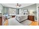 Serene main bedroom featuring a large window, soft lighting, and stylish furniture at 315 Muirfield Way, Salisbury, NC 28144