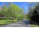 Picturesque walking trail surrounded by lush greenery and mature trees at 315 Muirfield Way, Salisbury, NC 28144