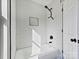 Modern bathroom featuring white subway tile, matte black hardware, and a built-in shower niche at 3201 Decapolis Dr, Charlotte, NC 28215