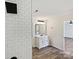 Bright bathroom features a glass-enclosed shower with subway tile and a modern vanity with great storage at 3201 Decapolis Dr, Charlotte, NC 28215