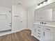 Modern bathroom features a glass-enclosed shower, sleek vanity, and hardwood floors for a luxurious feel at 3201 Decapolis Dr, Charlotte, NC 28215
