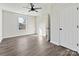 Bedroom with hardwood floors, ceiling fan, and closet for a simple yet functional space ready for personal touches at 3201 Decapolis Dr, Charlotte, NC 28215