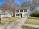 Two-story home with a one-car garage, long driveway, and manicured front yard at 3201 Decapolis Dr, Charlotte, NC 28215