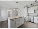 Bright kitchen featuring stainless steel appliances, granite countertops, a center island, and modern pendant lighting at 3201 Decapolis Dr, Charlotte, NC 28215