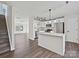 Bright open kitchen featuring stainless steel appliances, granite countertops, and an island with modern pendant lighting at 3201 Decapolis Dr, Charlotte, NC 28215