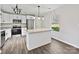Bright modern kitchen with stainless steel appliances, granite countertops, and an island with modern pendant lighting at 3201 Decapolis Dr, Charlotte, NC 28215