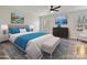 Comfortable main bedroom with blue bedding, stylish decor, and plenty of natural light from the double windows at 3201 Decapolis Dr, Charlotte, NC 28215
