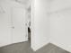 Walk-in closet with shelving and neutral carpeting at 32586 Millingport Rd # 7147, New London, NC 28127