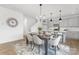 Open-concept dining area with views of the kitchen and living room, showcasing modern decor and finishes at 32586 Millingport Rd # 7147, New London, NC 28127