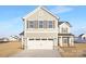 Charming two-story home with a two-car garage, gray siding, and traditional shuttered windows at 32586 Millingport Rd # 7147, New London, NC 28127
