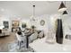 Bright open-concept layout with a dining area, decoratively set table, and spacious living room at 32586 Millingport Rd # 7147, New London, NC 28127