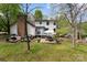 Spacious backyard with patio, brick chimney and lush greenery, perfect for entertaining at 3707 Banyon Nw Ct, Concord, NC 28027