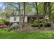 Attractive two-story home nestled among mature trees and beautiful landscaping at 3707 Banyon Nw Ct, Concord, NC 28027