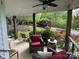 Relaxing porch featuring comfortable seating and views of the lush yard at 3707 Banyon Nw Ct, Concord, NC 28027
