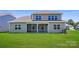 The backyard features a covered porch and a well-manicured lawn at 3886 Horsham St, Indian Land, SC 29707