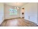 Elegant dining room featuring decorative molding, hardwood floors, and a modern chandelier at 3886 Horsham St, Indian Land, SC 29707