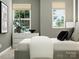 Stylish bedroom with an upholstered bed, natural light, and gray walls at 4104 Skyboat Cir, Fort Mill, SC 29715