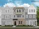 Three-story townhome showcasing a brick facade, neutral color palette, and large windows that accent the living spaces at 4104 Skyboat Cir, Fort Mill, SC 29715