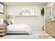 This is a secondary bedroom with neutral walls, a side table, and bright natural light at 4171 Skyboat Cir, Fort Mill, SC 29715