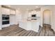 Modern kitchen with white cabinets, quartz countertops, stainless steel appliances, and island at 4171 Skyboat Cir, Fort Mill, SC 29715