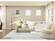 Bright, cozy living room featuring a comfortable sofa, decorative pillows, and natural light at 4171 Skyboat Cir, Fort Mill, SC 29715