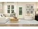 Bright living room with a comfortable white sofa, neutral decor, and an open layout at 4171 Skyboat Cir, Fort Mill, SC 29715