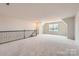 Spacious loft featuring carpet and a window with a view of the neighborhood at 4171 Skyboat Cir, Fort Mill, SC 29715