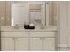 Well-lit bathroom featuring double sinks, a white vanity, and neutral decor at 4203 Skyboat Cir, Fort Mill, SC 29715