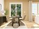 Casual dining room featuring woven chairs, a sleek table, and plenty of natural light at 4203 Skyboat Cir, Fort Mill, SC 29715