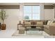 This spacious living room features modern décor, a large window and beautiful sunlight at 4203 Skyboat Cir, Fort Mill, SC 29715