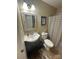 Bathroom featuring tile flooring, vanity, toilet, and decorative mirror at 52 Restful Ln, Hickory, NC 28601