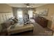 Comfortable bedroom with soft carpet, ceiling fan, and natural light from two windows at 52 Restful Ln, Hickory, NC 28601