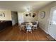 Well-lit dining room featuring hardwood floors, stylish décor and access to the front door at 52 Restful Ln, Hickory, NC 28601