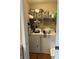 Laundry room featuring a washer, dryer, and some storage shelves for household essentials at 52 Restful Ln, Hickory, NC 28601